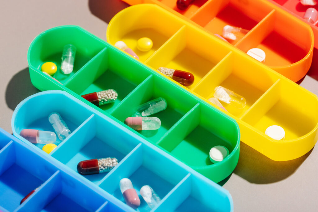 bright multi colored pill boxes with medicines on 2023 03 24 22 55 05 utc 1024x683