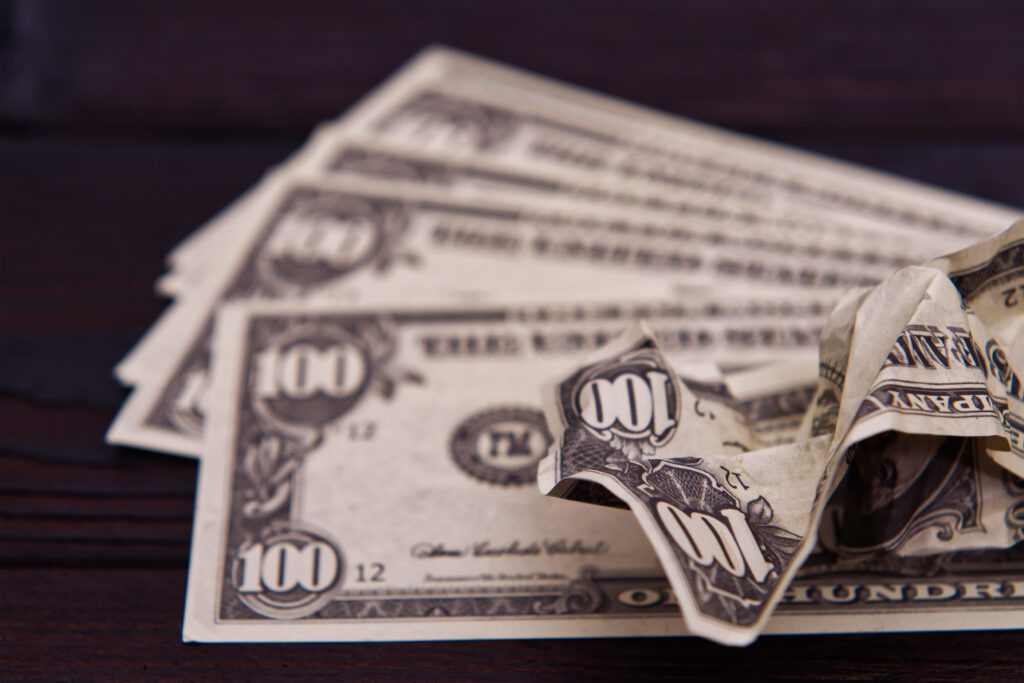 dollar banknotes on a wooden table 2021 09 01 21 09 37 utc 1024x683