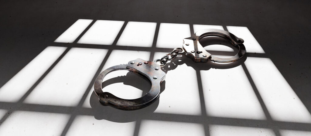 prison concept jail bar and handcuff on the dunge 2022 12 16 12 26 29 utc 1024x448