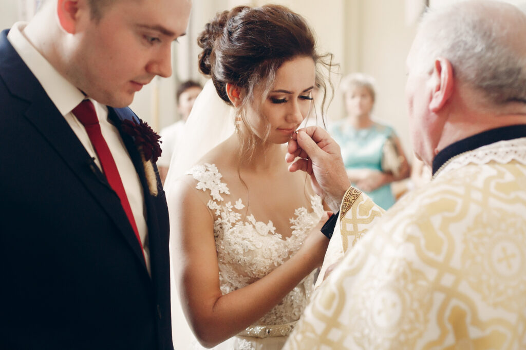 stylish bride and handsome groom in church during 2021 08 29 10 50 18 utc 1024x683