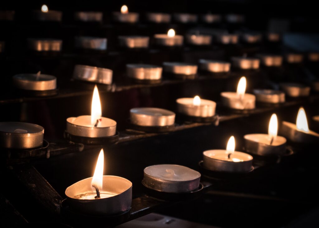 closeup shot of lighted prayer candles in cocking 2023 03 03 20 48 30 utc 1 1024x732