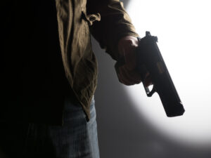 man holding a gun 2021 09 03 01 32 00 utc scaled