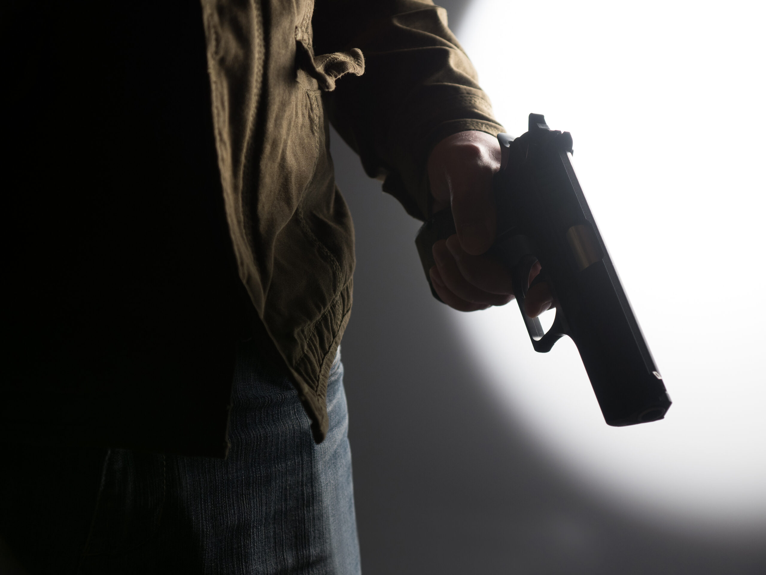 man holding a gun 2021 09 03 01 32 00 utc scaled