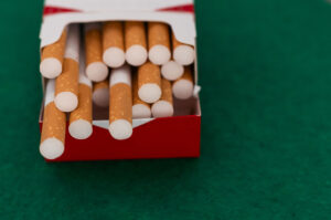 open pack of cigarettes standing isolated green 2023 11 27 04 50 57 utc 1 scaled