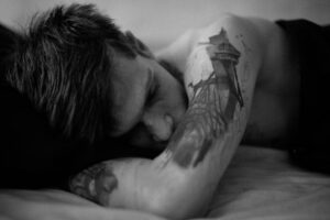 sad man black and white shot sleep 2023 11 27 05 19 59 utc