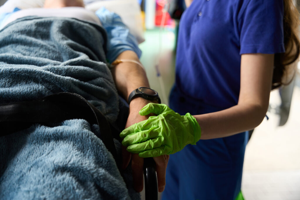 woman paramedic makes a drip to an injured patient 2023 11 27 05 28 15 utc scaled
