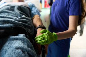 woman paramedic makes a drip to an injured patient 2023 11 27 05 28 15 utc scaled