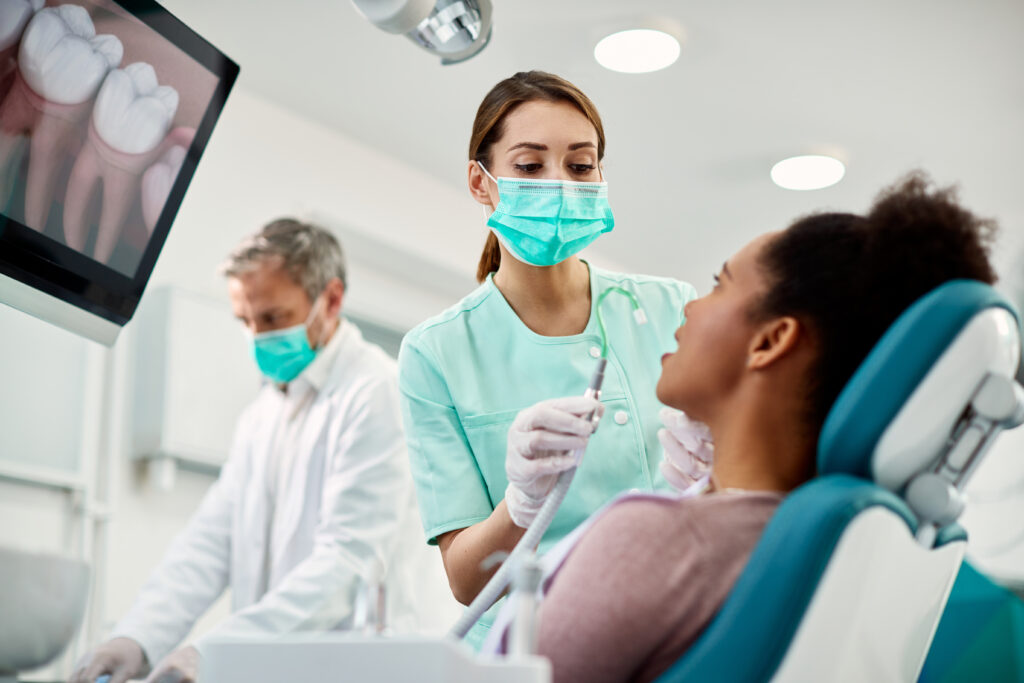 young nurse preparing patient for dental procedure 2023 11 27 05 29 32 utc scaled