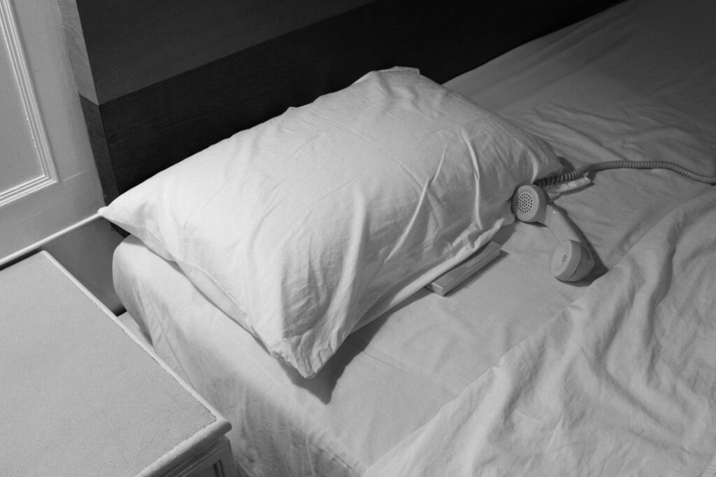 old telephone on the bed in hotel 2023 11 27 04 57 05 utc 1 scaled