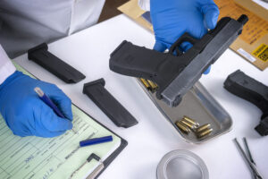 police scientist examines firearm involved in murd 2023 11 27 04 50 49 utc scaled