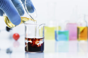 scientist pouring iron chloride into beaker of pot 2024 06 21 16 15 05 utc scaled