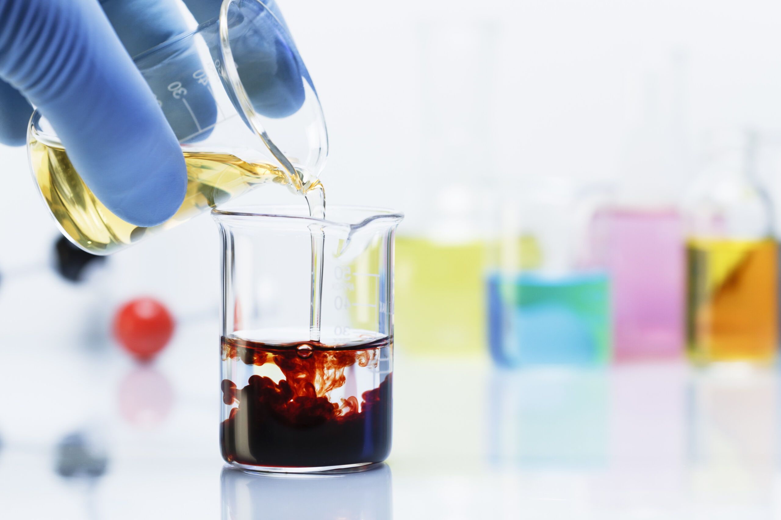 scientist pouring iron chloride into beaker of pot 2024 06 21 16 15 05 utc scaled