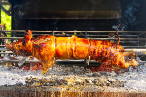 whole pig spit roasted pig roasted on a barbecue 2023 11 27 05 26 16 utc scaled
